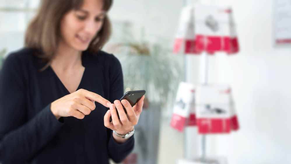 Woman typing on a smartphone