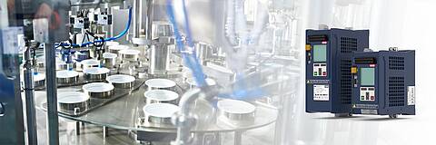 Two COMBIVERT G6 frequency inverters on the right and a packing machine in the food industry on the left