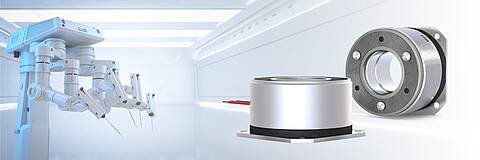 on the right side: 2 COMBIPERM permanent magnet brakes from KEB Automation, on the left side: a medical surgery robot. in the background: a clean white surgery room